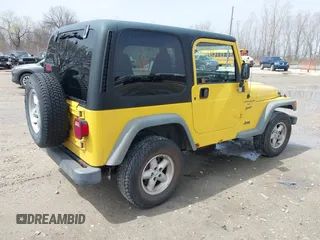 2000 Jeep Wrangler Sport with VIN 1J4FA49S2YP768451, listed as a IAAI auction lot 42136785 with 74,492 mi miles. Bid and sale history available at carsss.com. Image 4.