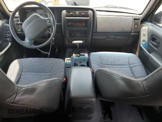 1999 Jeep Cherokee Sport with VIN 1J4FT68SXXL669549, listed as a Copart auction lot 62367015 with 194,446 mi miles and Salvage title. Bid and sale history available at DreamBid. Image 8.