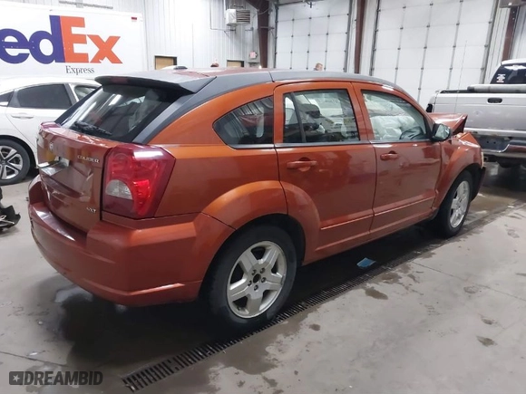 2009 Dodge Caliber SXT with VIN 1B3HB48A39D233346, listed as a IAAI auction lot 41068002 with 100,306 mi miles. Bid and sale history available at carsss.com. Image 4.