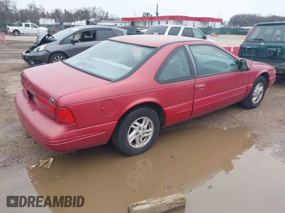 1997 Ford Thunderbird LX with VIN 1FALP6248VH134894, listed as a IAAI auction lot 41551957 with 136,435 mi miles and . Bid and sale history available at DreamBid. Image 4.