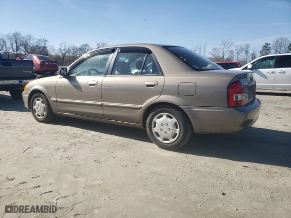2000 Mazda Protege DX with VIN JM1BJ2227Y0247785, listed as a Copart auction lot 43501105 with 214,380 mi miles and Salvage Title. Bid and sale history available at carsss.com. Image 2.