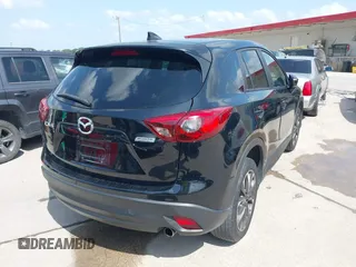 2016 Mazda CX-5 Grand Touring z VIN JM3KE2DY2G0765444, wystawiony jako IAAI lot #42527577 z przebiegiem 162 871 mil mil oraz . Historia ofert i sprzedaży dostępna na DreamBid. Obrazek 4.