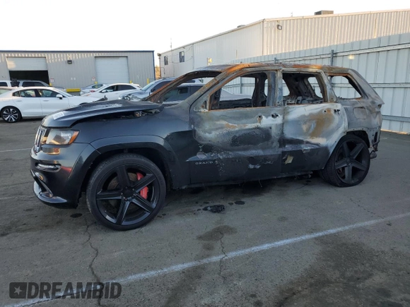 2012 Jeep Grand Cherokee SRT8 with VIN 1C4RJFDJ1CC311983, listed as a Copart auction lot 87966635 with 0 mi miles and Non Repairable. Bid and sale history available at carsss.com. Image 1.
