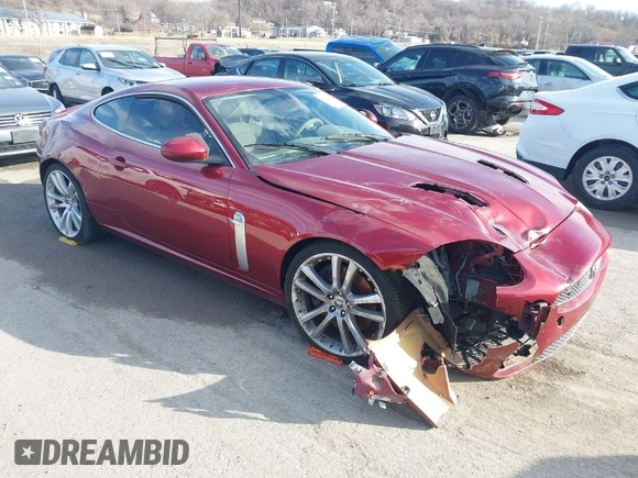 2008 Jaguar XK with VIN SAJWA43C089B22700, listed as a IAAI auction lot 41585734 with 67,946 mi miles. Bid and sale history available at carsss.com. Image 1.