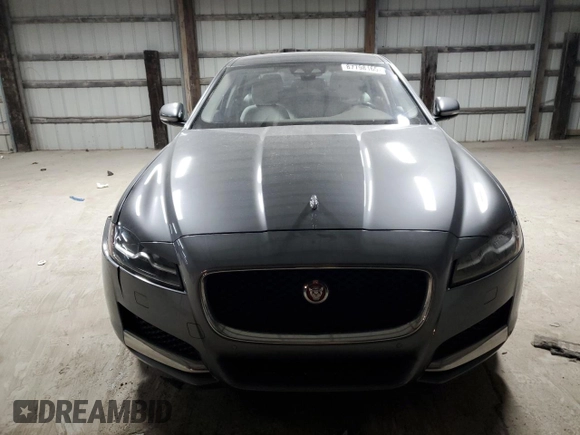 2017 Jaguar XF with VIN SAJBJ4BN3HCY42655, listed as a Copart auction lot 87798165 with 80,700 mi miles and Salvage Title. Bid and sale history available at DreamBid. Image 5.