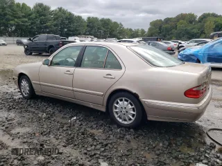 2001 Mercedes-Benz E-Class with VIN WDBJF65J01B389296, listed as a Copart auction lot 71933404 with 124,392 mi miles and Salvage Title. Bid and sale history available at carsss.com. Image 2.