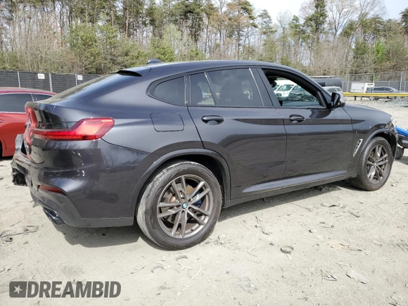 2019 BMW X4 M40i with VIN 5UXUJ5C5XKLJ64004, listed as a Copart auction lot 52106895 with 74,599 mi miles and Salvage title. Bid and sale history available at DreamBid. Image 3.