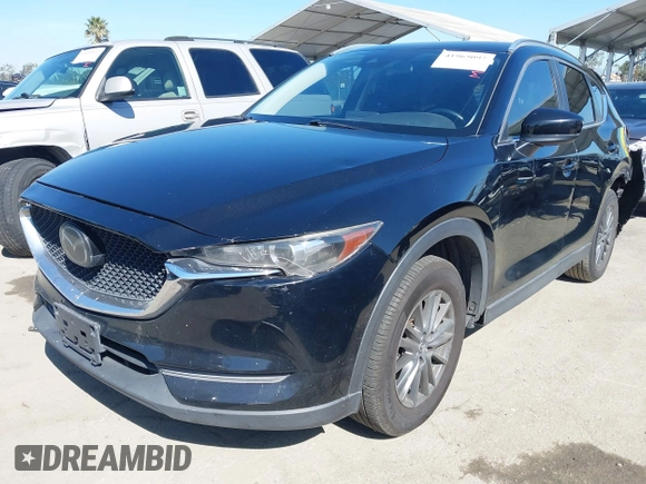 2019 Mazda CX-5 Sport with VIN JM3KFABM7K1579747, listed as a IAAI auction lot 41965097 with 151,042 mi miles and . Bid and sale history available at DreamBid. Image 2.