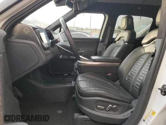 2022 Rivian R1T Adventure z VIN 7FCTGAAA9NN014280, wystawiony jako Copart lot #87908175 z przebiegiem 28 601 mil mil oraz Szkody całkowita. Historia ofert i sprzedaży dostępna na DreamBid. Obrazek 7.