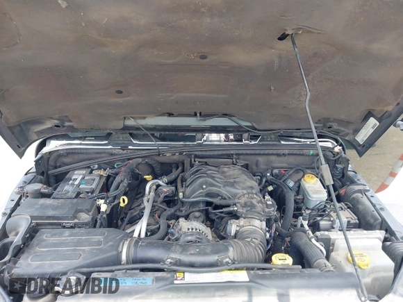2012 Jeep Wrangler Sahara z VIN 1C4AJWBGXCL100527, wystawiony jako IAAI lot #42394623 z przebiegiem 126 097 mil mil oraz . Historia ofert i sprzedaży dostępna na DreamBid. Obrazek 10.