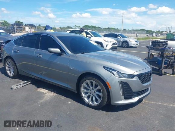 2023 Cadillac CT5 Luxury z VIN 1G6DW5RK3P0106764, wystawiony jako IAAI lot #42491584 z przebiegiem 32 223 mil mil oraz . Historia ofert i sprzedaży dostępna na DreamBid. Obrazek 1.