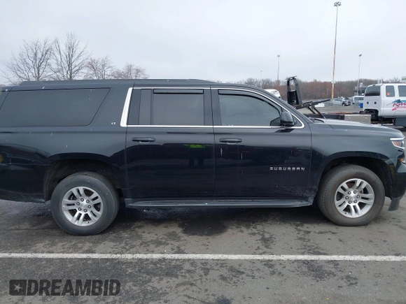 2019 Chevrolet Suburban LT with VIN 1GNSKHKCXKR345468, listed as a IAAI auction lot 41825030 with 155,783 mi miles and . Bid and sale history available at DreamBid. Image 13.