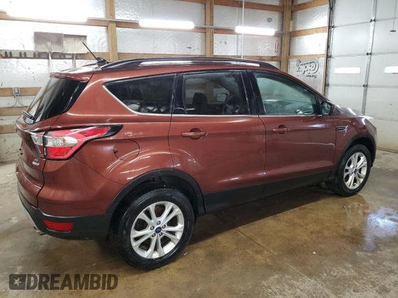 2018 Ford Escape SE z VIN 1FMCU9GD2JUA21582, wystawiony jako Copart lot #56165155 z przebiegiem 88 881 mil mil oraz Czysty tytuł • Clean title. Historia ofert i sprzedaży dostępna na DreamBid. Obrazek 3.
