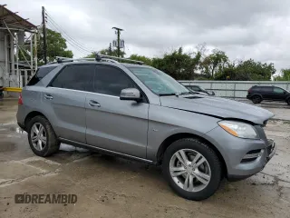 2012 Mercedes-Benz M 350 with VIN 4JGDA5HB2CA027986, listed as a Copart auction lot 71714874 with 165,916 mi miles and Salvage title. Bid and sale history available at DreamBid. Image 4.
