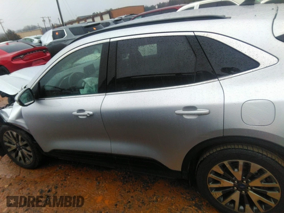 2020 Ford Escape Titanium Hybrid with VIN 1FMCU0DZ8LUB13911, listed as a IAAI auction lot 41249498 with 64,108 mi miles and . Bid and sale history available at DreamBid. Image 14.