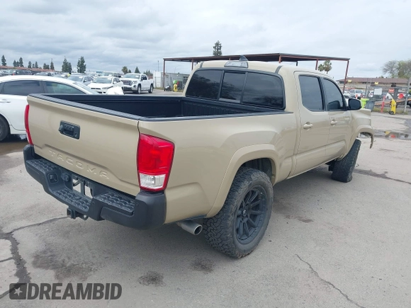 2016 Toyota Tacoma SR5 with VIN 3TMDZ5BN3GM003351, listed as a IAAI auction lot 41721932 with 100,774 mi miles and . Bid and sale history available at DreamBid. Image 4.