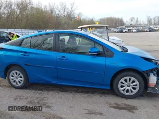 2021 Toyota Prius L Eco with VIN JTDKAMFU5M3145949, listed as a IAAI auction lot 42113123 with 127,872 mi miles and . Bid and sale history available at DreamBid. Image 13.