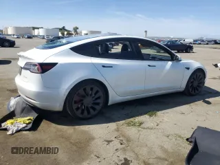 2021 Tesla Model 3 Performance with VIN 5YJ3E1ECXMF091342, listed as a Copart auction lot 49987595 with 120,881 mi miles and Salvage Title. Bid and sale history available at DreamBid. Image 3.