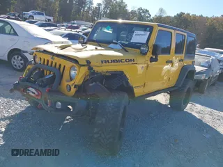 2015 Jeep Wrangler Unlimited Rubicon z VIN 1C4BJWFG4FL681946, wystawiony jako IAAI lot #40809597 z przebiegiem 57 148 mil mil oraz . Historia ofert i sprzedaży dostępna na DreamBid. Obrazek 2.