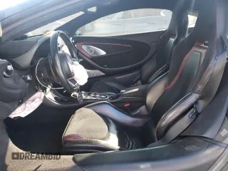2021 McLaren GT z VIN SBM22GCA8MW001374, wystawiony jako Copart lot #82147064 z przebiegiem 32 562 mil mil oraz Nie do naprawy. Historia ofert i sprzedaży dostępna na DreamBid. Obrazek 7.