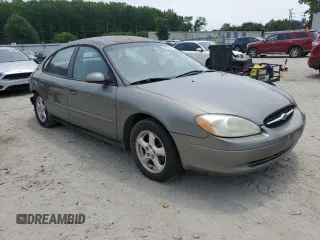 2002 Ford Taurus SES Standard with VIN 1FAFP55U42A184084, listed as a Copart auction lot 59822495 with 124,835 mi miles and Salvage title. Bid and sale history available at DreamBid. Image 4.