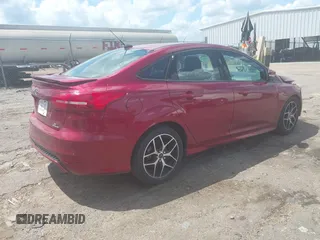 2015 Ford Focus SE z VIN 1FADP3F25FL313033, wystawiony jako IAAI lot #42206507 z przebiegiem 142 938 mil mil oraz . Historia ofert i sprzedaży dostępna na DreamBid. Obrazek 4.