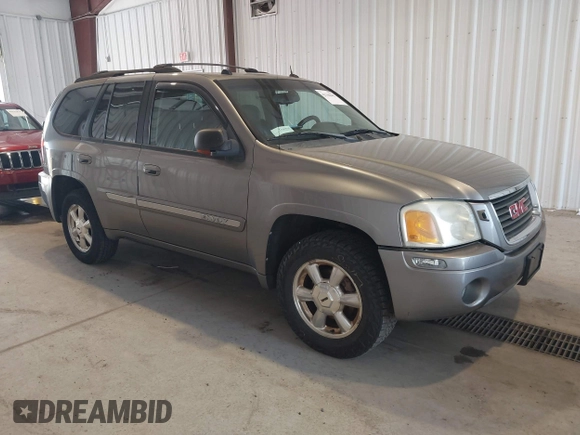 2005 GMC Envoy SLE z VIN 1GKDT13S252285747, wystawiony jako IAAI lot #42340642 z przebiegiem Nie podano mil oraz . Historia ofert i sprzedaży dostępna na DreamBid. Obrazek 1.