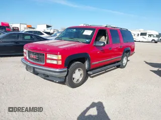 1999 GMC Suburban with VIN 1GKFK16RXXJ809823, listed as a IAAI auction lot 41687406 with 360,799 mi miles. Bid and sale history available at carsss.com. Image 2.