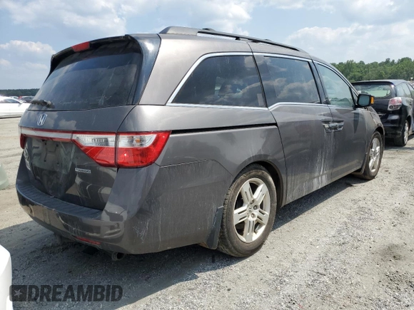 2011 Honda Odyssey Touring with VIN 5FNRL5H91BB045838, listed as a Copart auction lot 59612315 with Not provided miles and Salvage title. Bid and sale history available at DreamBid. Image 3.