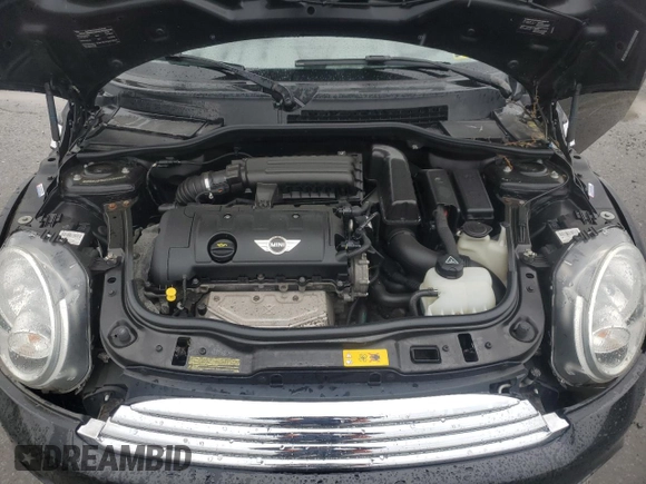 2013 MINI Hardtop z VIN WMWSU3C56DT689582, wystawiony jako Copart lot #58364685 z przebiegiem Nie podano mil oraz Szkoda całkowita • Salvage title. Historia ofert i sprzedaży dostępna na DreamBid. Obrazek 11.