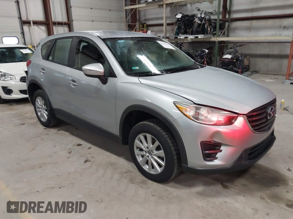 2016 Mazda CX-5 Sport with VIN JM3KE2BY2G0718434, listed as a IAAI auction lot 41961364 with 145,748 mi miles. Bid and sale history available at carsss.com. Image 1.