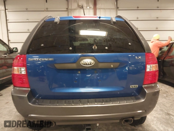 2006 Kia Sportage LX z VIN KNDJE723467245423, wystawiony jako IAAI lot #41388807 z przebiegiem 135 484 mil mil oraz . Historia ofert i sprzedaży dostępna na DreamBid. Obrazek 17.