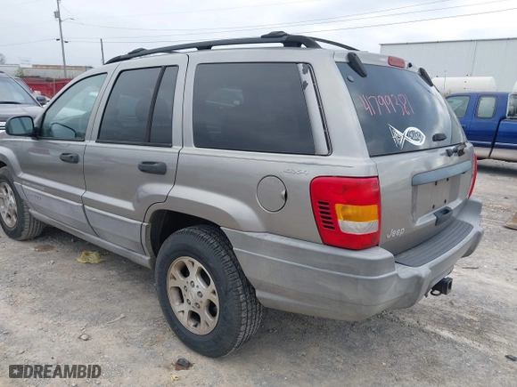 1999 Jeep Grand Cherokee Laredo with VIN 1J4GW58N4XC676836, listed as a IAAI auction lot 41799381 with 203,784 mi miles. Bid and sale history available at carsss.com. Image 3.