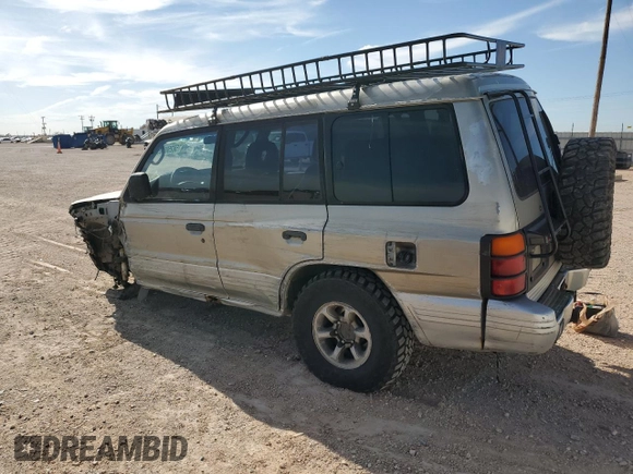 1998 Mitsubishi Montero z VIN JA4MR51R0WJ000921, wystawiony jako Copart lot #56250965 z przebiegiem 181 293 mil mil oraz Szkoda całkowita • Salvage title. Historia ofert i sprzedaży dostępna na DreamBid. Obrazek 2.