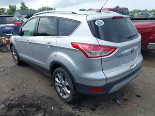 2016 Ford Escape Titanium with VIN 1FMCU9J95GUB93585, listed as a IAAI auction lot 42614106 with 124,465 mi miles and . Bid and sale history available at DreamBid. Image 3.
