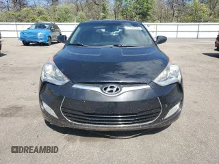 2013 Hyundai Veloster w/Gray Int z VIN KMHTC6ADXDU092253, wystawiony jako Copart lot #57708055 z przebiegiem 141 904 mil mil oraz Tytuł czysty. Historia ofert i sprzedaży dostępna na DreamBid. Obrazek 5.