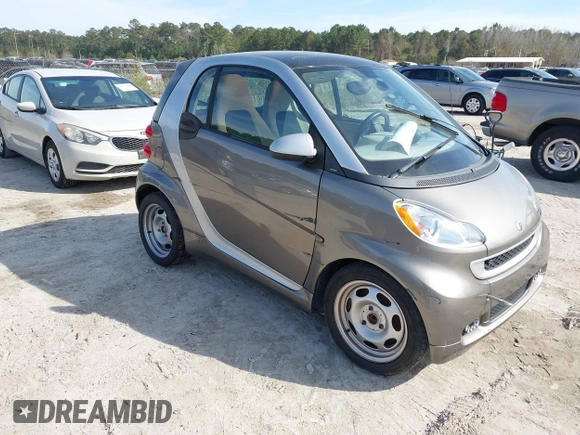 2012 Smart fortwo Pure z VIN WMEEJ3BA9CK557221, wystawiony jako IAAI lot #41828029 z przebiegiem 54 516 mil mil oraz . Historia ofert i sprzedaży dostępna na DreamBid. Obrazek 1.