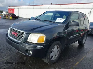 2003 GMC Envoy SLT with VIN 1GKDT13S732283859, listed as a IAAI auction lot 41219105 with 172,953 mi miles. Bid and sale history available at carsss.com. Image 2.