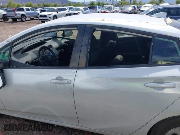 2022 Toyota Prius L Eco with VIN JTDKAMFUXN3181752, listed as a IAAI auction lot 42015717 with 129,637 mi miles and . Bid and sale history available at DreamBid. Image 14.