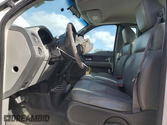 2007 Ford F-150 XL with VIN 1FTRF14517KC85159, listed as a Copart auction lot 83807384 with 178,898 mi miles and Salvage title. Bid and sale history available at DreamBid. Image 7.