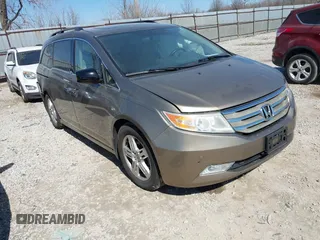 2012 Honda Odyssey Touring with VIN 5FNRL5H9XCB110672, listed as a IAAI auction lot 41826895 with 159,927 mi miles. Bid and sale history available at carsss.com. Image 1.