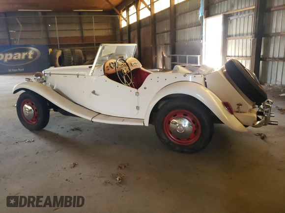 1971 Volkswagen Beetle with VIN 1112313102, listed as a Copart auction lot 55659265 with 3,677 mi miles and Salvage Title. Bid and sale history available at DreamBid. Image 2.