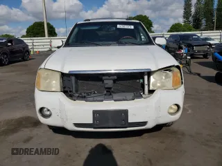2005 GMC Envoy Denali z VIN 1GKES63MX52321416, wystawiony jako Copart lot #57587575 z przebiegiem 252 571 mil mil oraz Szkody całkowita. Historia ofert i sprzedaży dostępna na DreamBid. Obrazek 5.