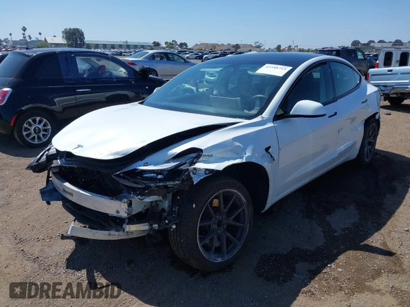 2023 Tesla Model 3 with VIN 5YJ3E1EA2PF571569, listed as a IAAI auction lot 42288715 with 30,271 mi miles and . Bid and sale history available at DreamBid. Image 6.