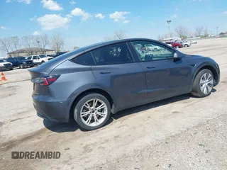 2022 Tesla Model Y Long Range with VIN 7SAYGDEE3NA007737, listed as a IAAI auction lot 42128359 with 42,597 mi miles and . Bid and sale history available at carsss.com. Image 4.