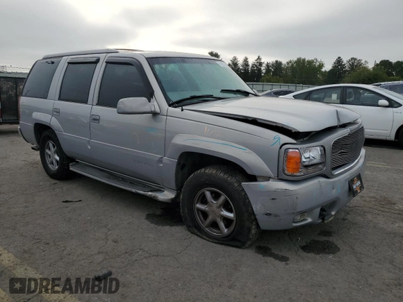 2000 GMC Denali z VIN 1GKEK13RXYR110436, wystawiony jako Copart lot #74311244 z przebiegiem 250 735 mil mil oraz Szkody całkowita. Historia ofert i sprzedaży dostępna na DreamBid. Obrazek 4.