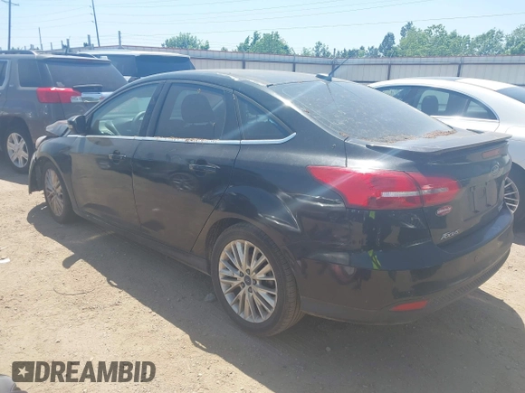 2015 Ford Focus Titanium with VIN 1FADP3J24FL385526, listed as a IAAI auction lot 42011712 with 162,696 mi miles and . Bid and sale history available at carsss.com. Image 3.