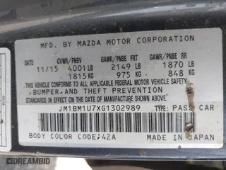 2016 Mazda Mazda3 i Sport with VIN JM1BM1U7XG1302989, listed as a IAAI auction lot 41828899 with NaN miles. Bid and sale history available at carsss.com. Image 9.