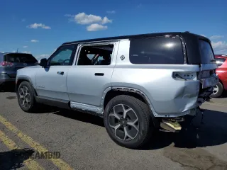 2024 Rivian R1S Adventure with VIN 7PDSGBBA4RN036045, listed as a Copart auction lot 74982414 with 9,256 mi miles and Salvage Title. Bid and sale history available at carsss.com. Image 2.
