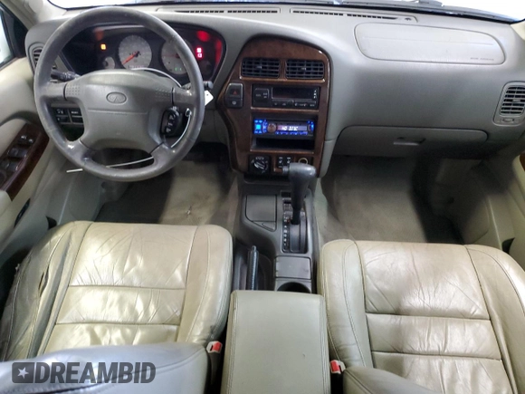 2000 Infiniti QX4 z VIN JNRAR07Y3YW084474, wystawiony jako Copart lot #87089994 z przebiegiem 237 974 mil mil oraz Szkody całkowita. Historia ofert i sprzedaży dostępna na DreamBid. Obrazek 8.